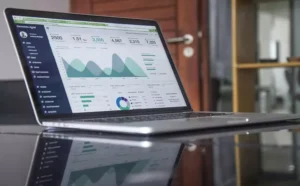 Team members collaborating at multiple monitors displaying data, graphs, and analytics to understand the marketing automation customer journey